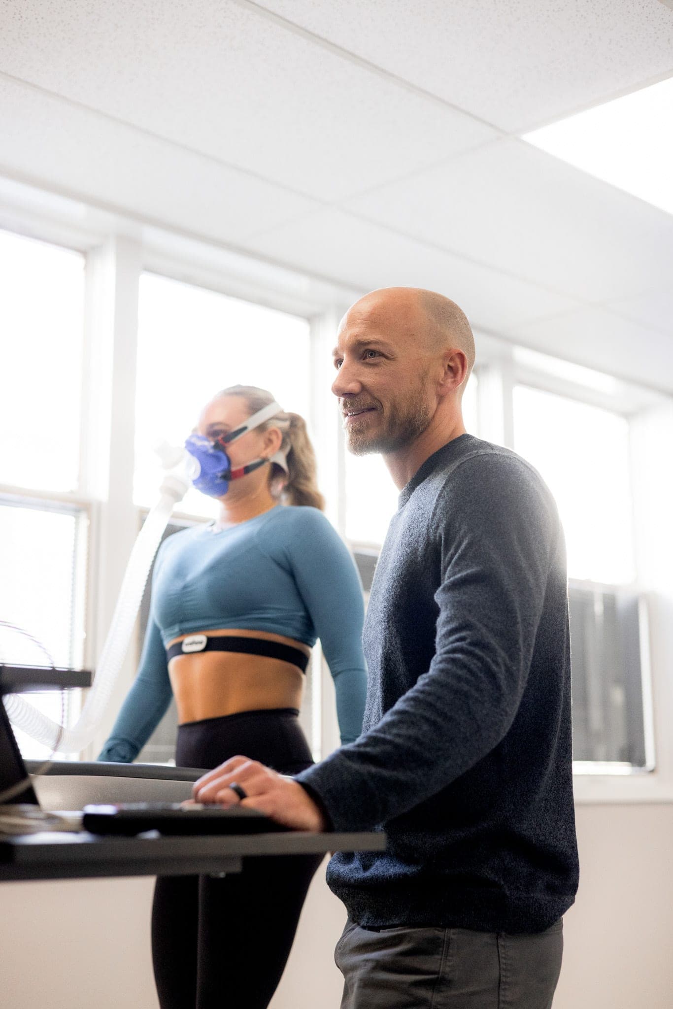 Dr. Tennyson guiding a patient through a VO₂ max treadmill test at TMD Health in Red Bank